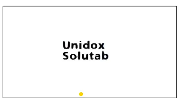 Napis "Unidox Solutab" na białym tle. Mały żółty okrąg na dole.